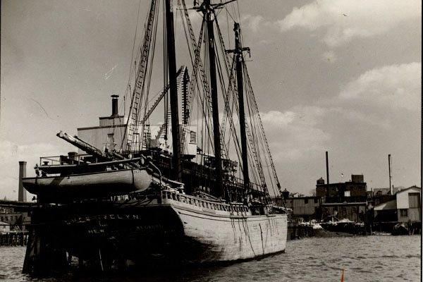 Black and white photograph of 19th century clipper ship in the East Boston Harbor