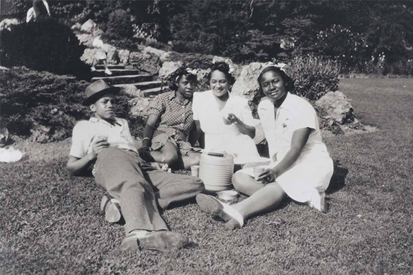 Malcolm X at age 15 with his sister and friends in Franklin Park